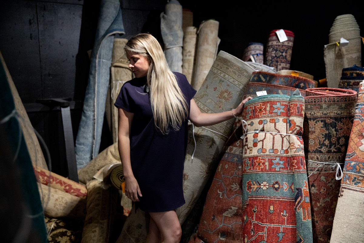 woman browsing rugs