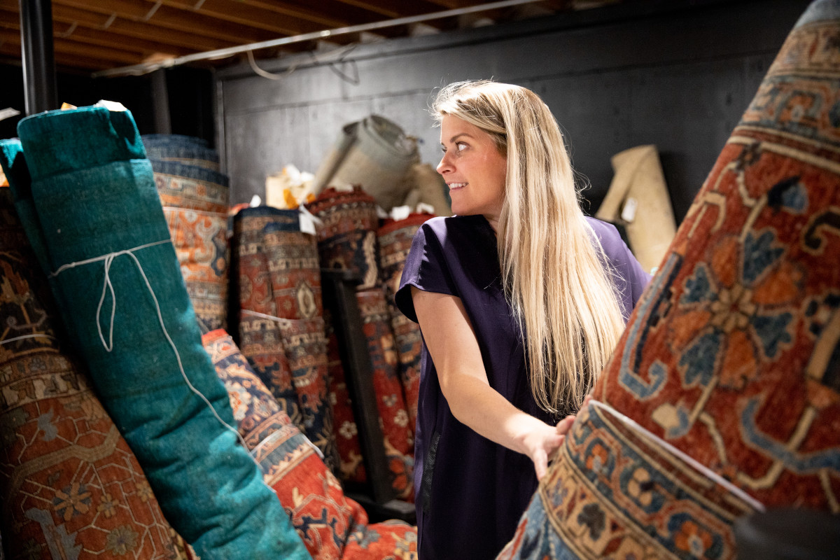 woman browsing rugs
