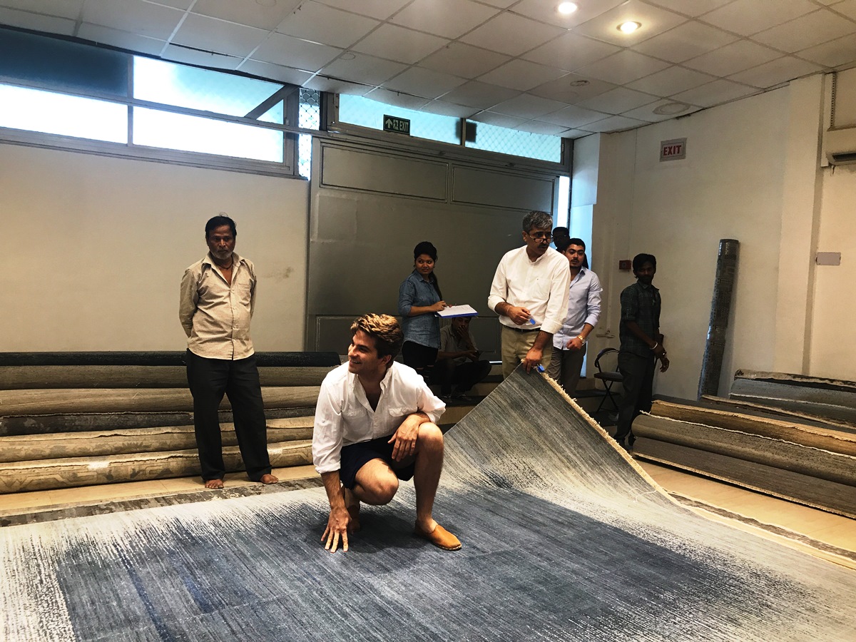 den selecting a massive rug