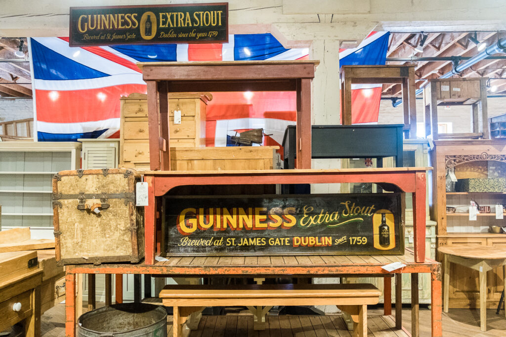 guinness extra stout sign on wood tables