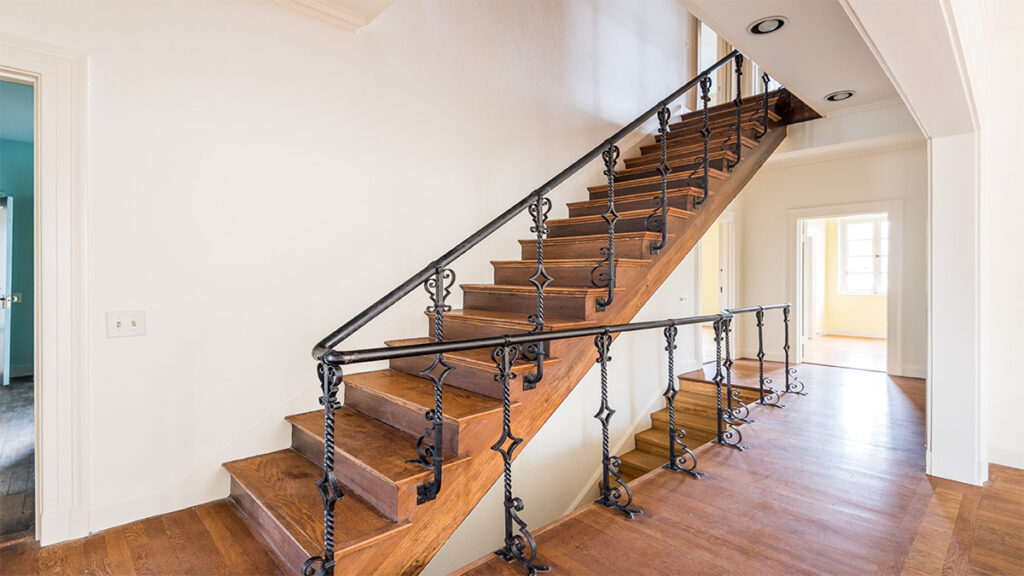 Green Front interiors project, staircase with iron railing