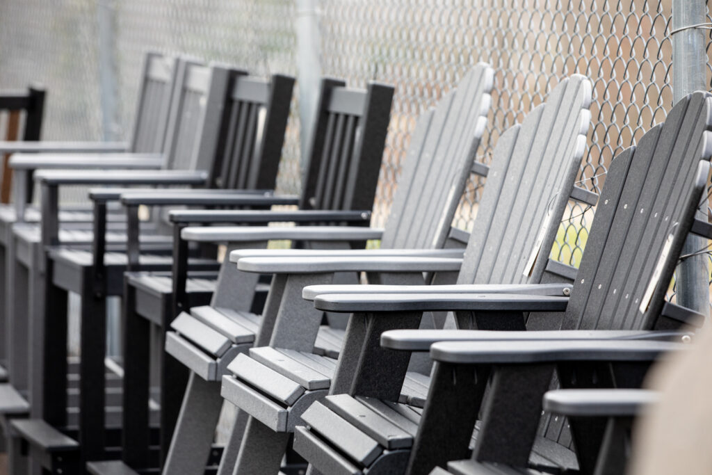 Outdoor furniture selection at Green Front Furniture, black Adirondack chairs